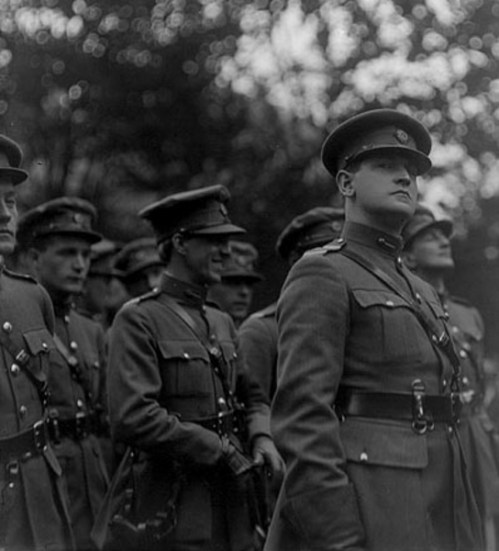 A now iconic image of Michael Collins, taking at the funeral of Arthur Griffith.