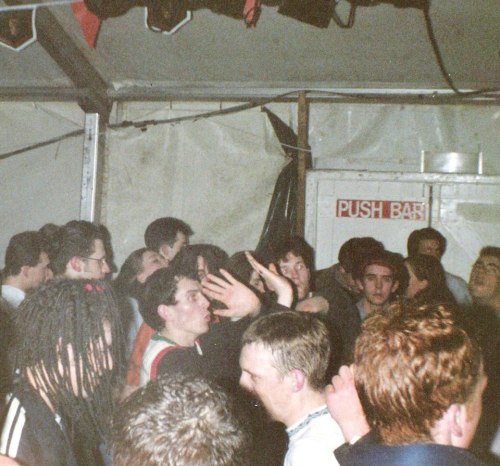 Liam with raised hands at The Shamen gig , UCD Rag Ball in March 1991 - Photo Paul O'Sullivan. via Where Were You?
