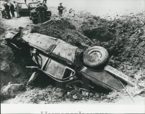 Scene after land mine destroys the car of Christopher. Credit - keptelenseg.hu