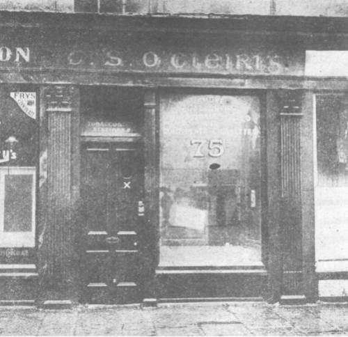 Thomas Clarke's Tobacco shop and newsagents, notice the Irish language signage.