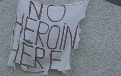 Still from news report, showing a banner in Tallaght proclaiming 'No Heroin Here'