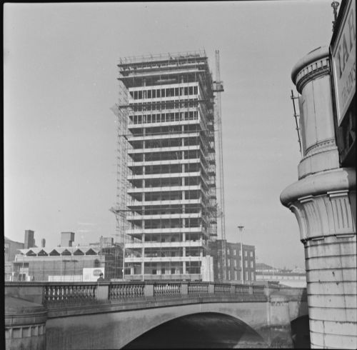 1024px-A_view_from_across_the_River_Liffey_in_Dublin_of_Liberty_Hall_under_construction